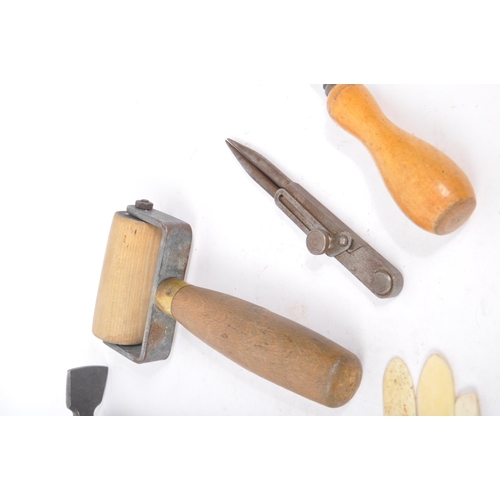 310 - A collection of mid Century and later vintage leather making tools to include scissors, leather cutt... 