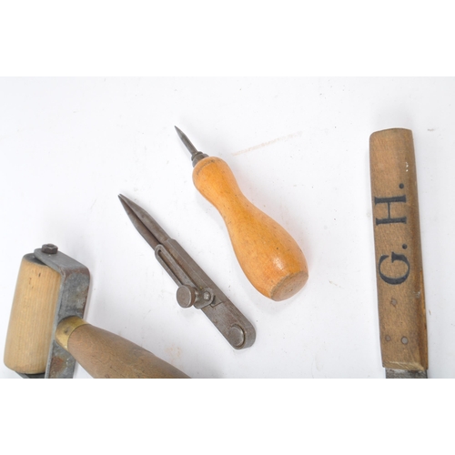 310 - A collection of mid Century and later vintage leather making tools to include scissors, leather cutt... 