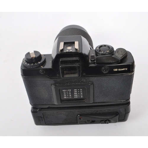 311 - Contax - A late 20th century Contax 139q (139 Quartz) 35mm camera and auto winder. The lot to includ... 