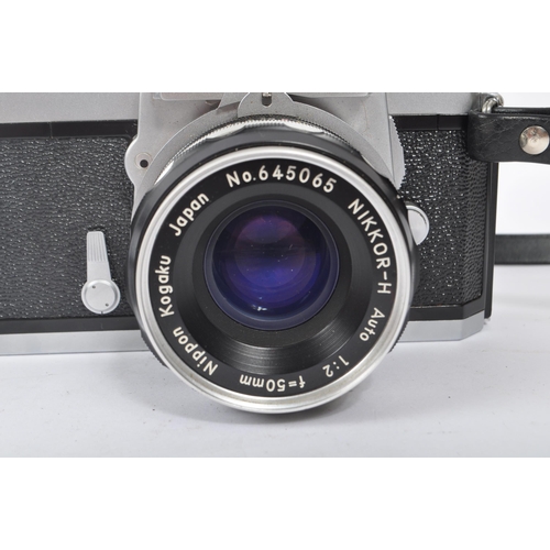 315 - Nikon - A mid 20th century Nikon Nikkormat ( Nikomat ) FT 35mm SLR camera. The camera having a silve... 