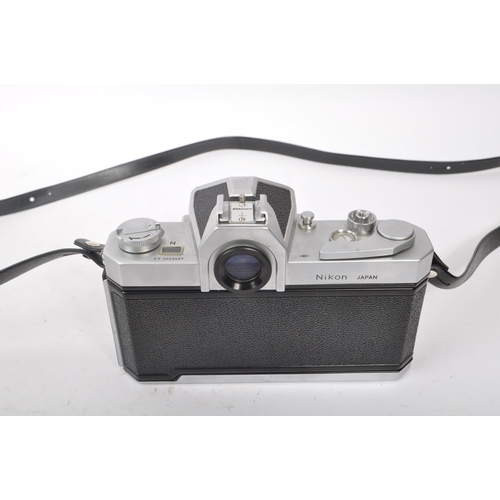 315 - Nikon - A mid 20th century Nikon Nikkormat ( Nikomat ) FT 35mm SLR camera. The camera having a silve... 