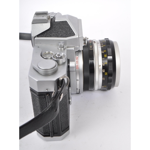 315 - Nikon - A mid 20th century Nikon Nikkormat ( Nikomat ) FT 35mm SLR camera. The camera having a silve... 