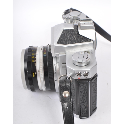 315 - Nikon - A mid 20th century Nikon Nikkormat ( Nikomat ) FT 35mm SLR camera. The camera having a silve... 