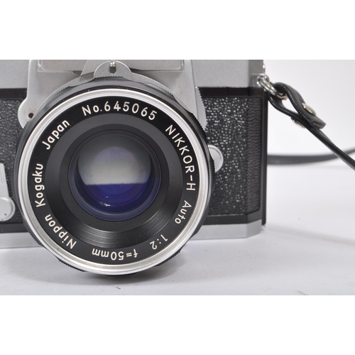 315 - Nikon - A mid 20th century Nikon Nikkormat ( Nikomat ) FT 35mm SLR camera. The camera having a silve... 