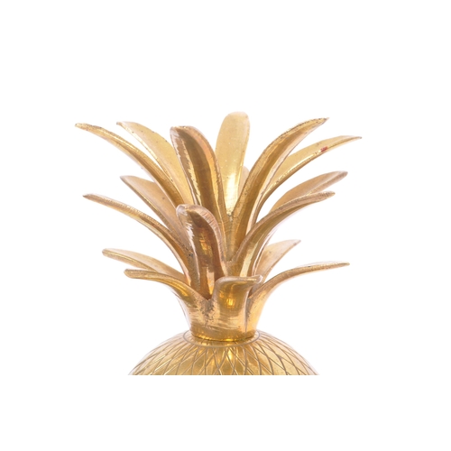 316 - A vintage mid 20th century circa 1960s brass pineapple ice bucket decoration. The pineapple having c... 