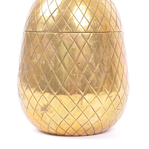 316 - A vintage mid 20th century circa 1960s brass pineapple ice bucket decoration. The pineapple having c... 