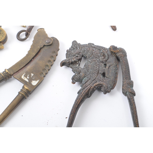 330 - A collection of 19th century & early 20th century Indian brass & bronze betel areca nut crackers. To... 