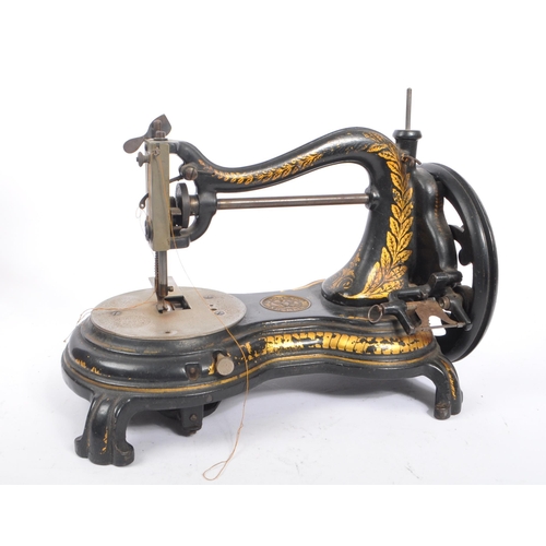 338 - Jones - A 19th century swan neck sewing machine by Jones & Co. The machine having ebonised body with... 