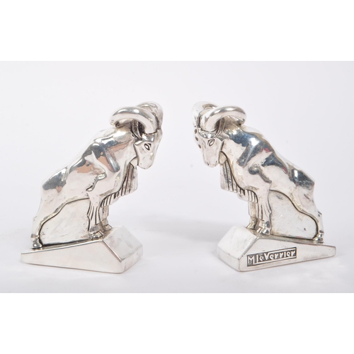 345 - Pair of 20th Century art deco style condiments in the form of mountain goats stamped 800 and having ... 