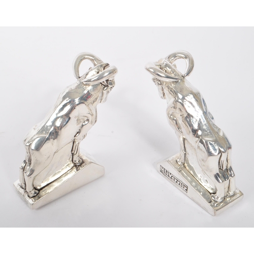 345 - Pair of 20th Century art deco style condiments in the form of mountain goats stamped 800 and having ... 