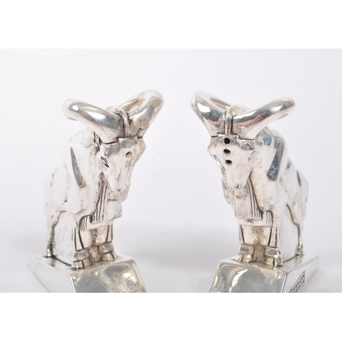 345 - Pair of 20th Century art deco style condiments in the form of mountain goats stamped 800 and having ... 