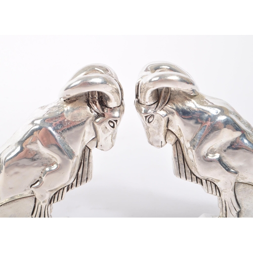 345 - Pair of 20th Century art deco style condiments in the form of mountain goats stamped 800 and having ... 