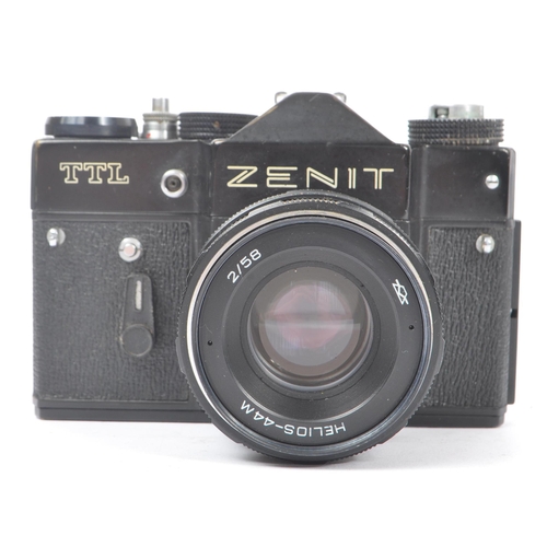 347 - Zenit - A late 20th century circa 1970s Zenit TTL 35mm SLR camera alongside a collection of M42 scre... 