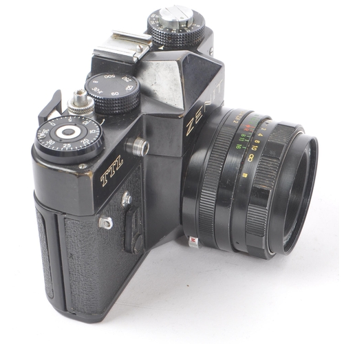 347 - Zenit - A late 20th century circa 1970s Zenit TTL 35mm SLR camera alongside a collection of M42 scre... 