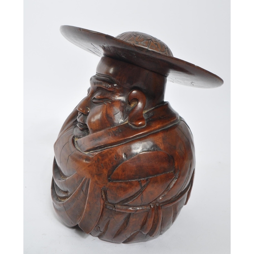 353 - A vintage 20th century carved wood Japanese figure. With carved removal able hat, in traditional rob... 