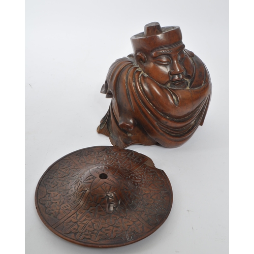 353 - A vintage 20th century carved wood Japanese figure. With carved removal able hat, in traditional rob... 