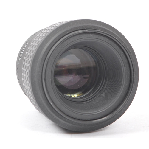 354 - Sigma - A Sigma EX 105mm F2.8 Macro AF lens. Serial number 1003012. Canon EF mount. Alongside a Tamr... 