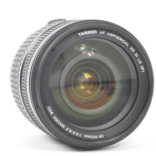 354 - Sigma - A Sigma EX 105mm F2.8 Macro AF lens. Serial number 1003012. Canon EF mount. Alongside a Tamr... 