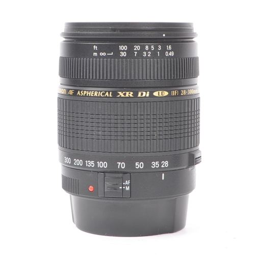 354 - Sigma - A Sigma EX 105mm F2.8 Macro AF lens. Serial number 1003012. Canon EF mount. Alongside a Tamr... 