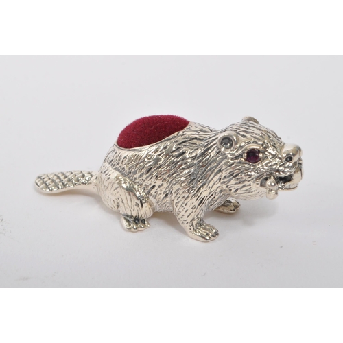 356 - A 20th Century vintage 925. sterling silver pin cushion in the form of a beaver with branch in mouth... 