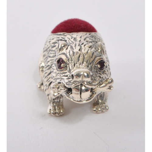 356 - A 20th Century vintage 925. sterling silver pin cushion in the form of a beaver with branch in mouth... 