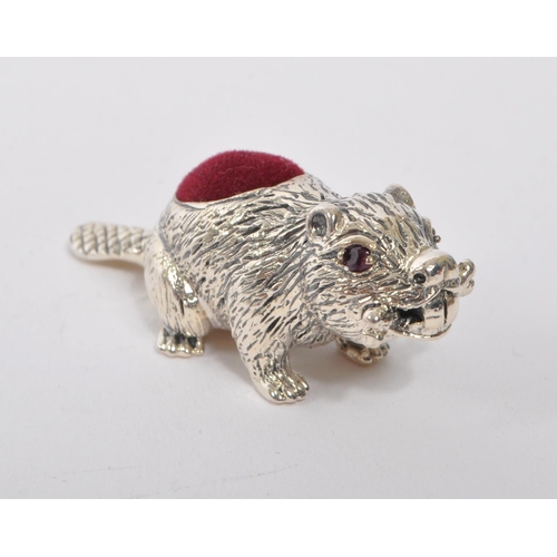 356 - A 20th Century vintage 925. sterling silver pin cushion in the form of a beaver with branch in mouth... 