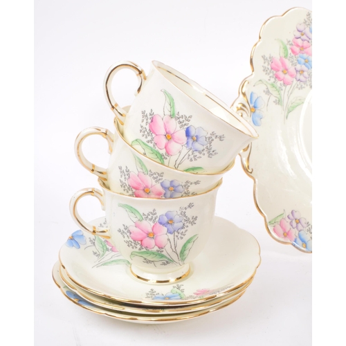 36 - Foley China - A 20th Century bone china porcelain Foley tea service having hand painted pink, purple... 