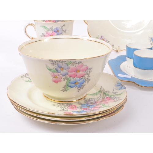 36 - Foley China - A 20th Century bone china porcelain Foley tea service having hand painted pink, purple... 