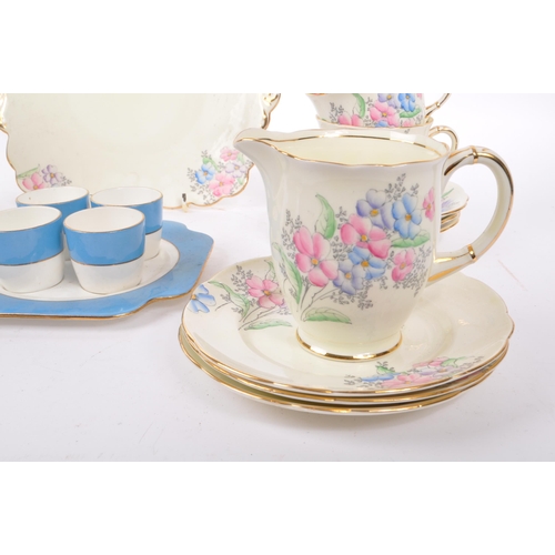 36 - Foley China - A 20th Century bone china porcelain Foley tea service having hand painted pink, purple... 