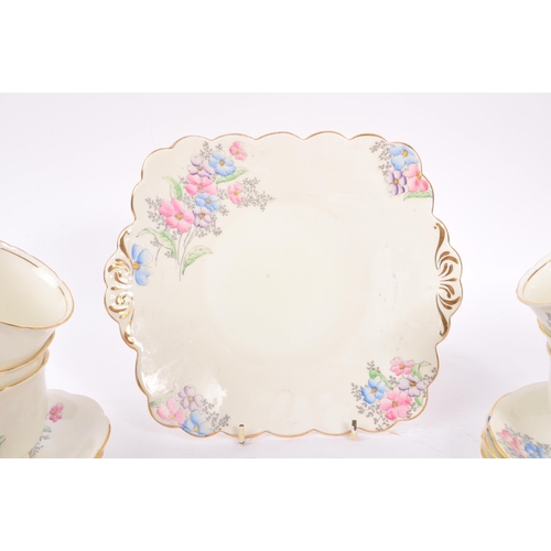 36 - Foley China - A 20th Century bone china porcelain Foley tea service having hand painted pink, purple... 