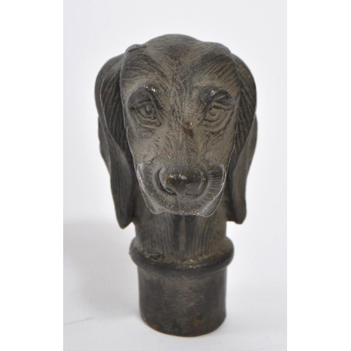 363 - A 20th Century vintage bronze walking cane handle in the form of a dog's head. Measuring approximate... 