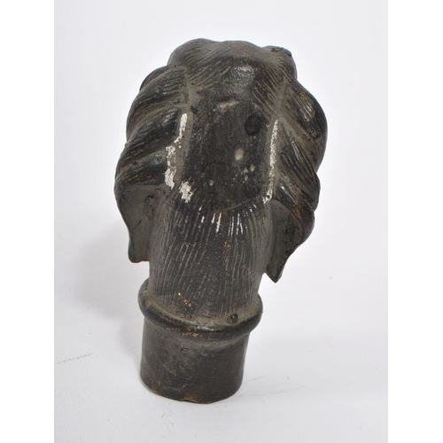 363 - A 20th Century vintage bronze walking cane handle in the form of a dog's head. Measuring approximate... 