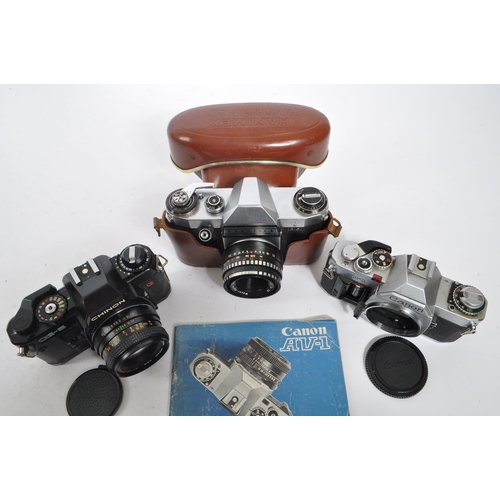 367 - Photographic Interest - A collection of three mid 20th century 35mm SLR cameras. The collection to i... 