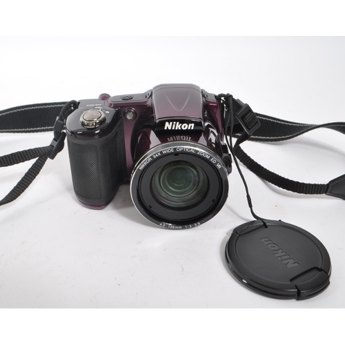 368 - Nikon - A Nikon Coolpix L830 digital bridge camera, alongside a Canon PowerShot SX 210 IS digital co... 