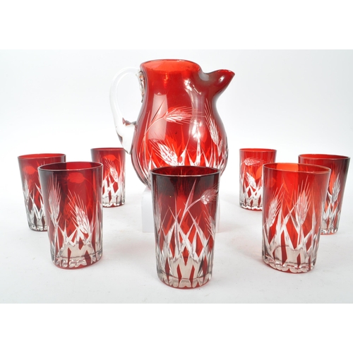 37 - A mid Century vintage Bohemian ruby / cranberry red cut glass drinking / lemonade set comprising of ... 