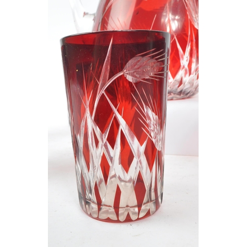 37 - A mid Century vintage Bohemian ruby / cranberry red cut glass drinking / lemonade set comprising of ... 