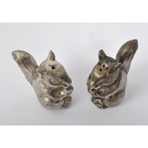 373 - Pair of novelty white metal cruet salt and pepper shakers in the form of squirrels. Measures approx.... 