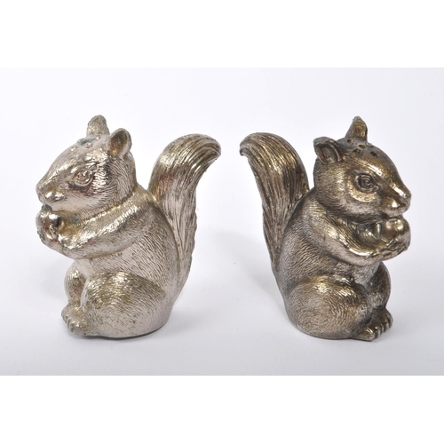 373 - Pair of novelty white metal cruet salt and pepper shakers in the form of squirrels. Measures approx.... 