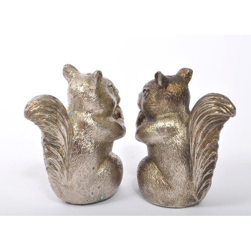 373 - Pair of novelty white metal cruet salt and pepper shakers in the form of squirrels. Measures approx.... 