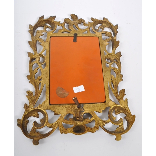 375 - A vintage early 20th century continental rococo baroque style table mirror. With ornate pierced flor... 