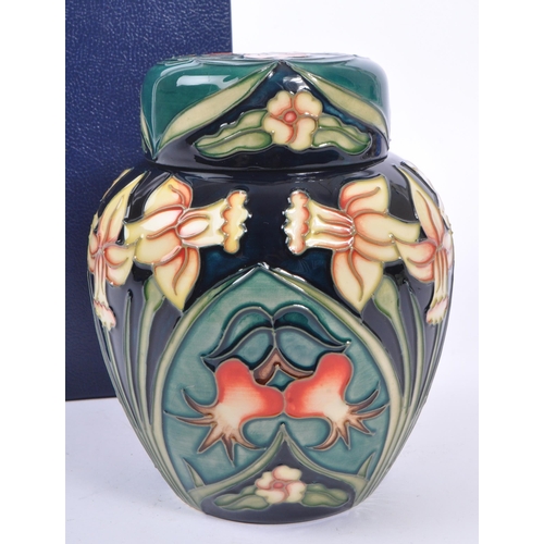 387 - Moorcroft - A china Moorcroft lidded pot / ginger jar in ' Carousel ' pattern design by Rachel Bisho... 