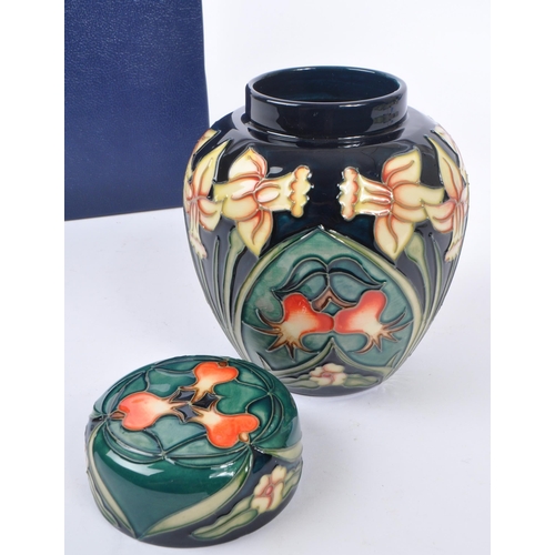 387 - Moorcroft - A china Moorcroft lidded pot / ginger jar in ' Carousel ' pattern design by Rachel Bisho... 