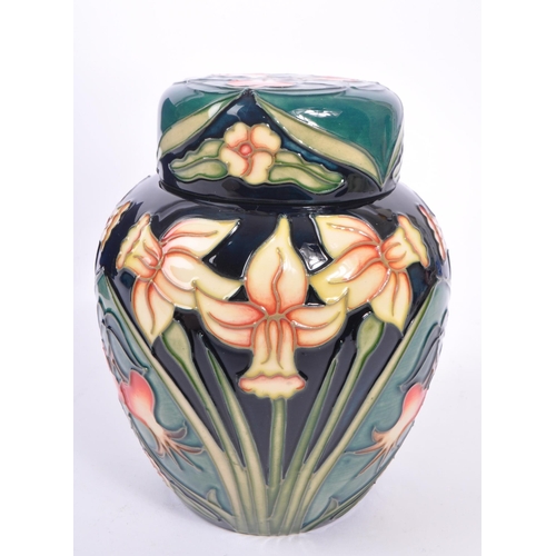 387 - Moorcroft - A china Moorcroft lidded pot / ginger jar in ' Carousel ' pattern design by Rachel Bisho... 