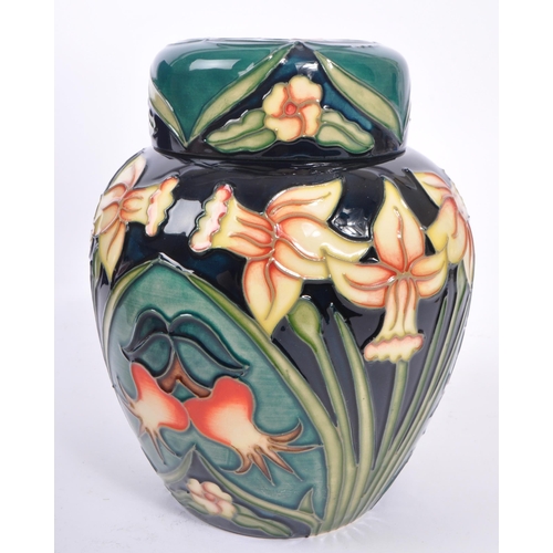 387 - Moorcroft - A china Moorcroft lidded pot / ginger jar in ' Carousel ' pattern design by Rachel Bisho... 