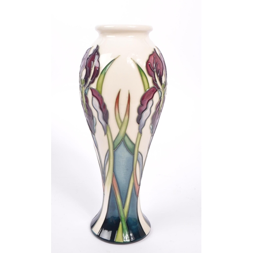 388 - Moorcroft - A china Moorcroft Pottery vase in the ' Antheia ' pattern designed by Nicola Slaney havi... 