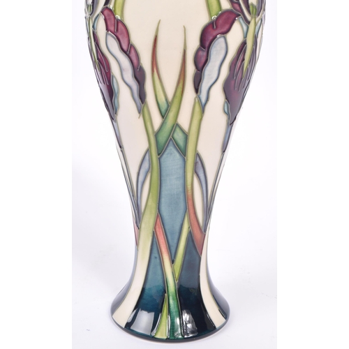 388 - Moorcroft - A china Moorcroft Pottery vase in the ' Antheia ' pattern designed by Nicola Slaney havi... 