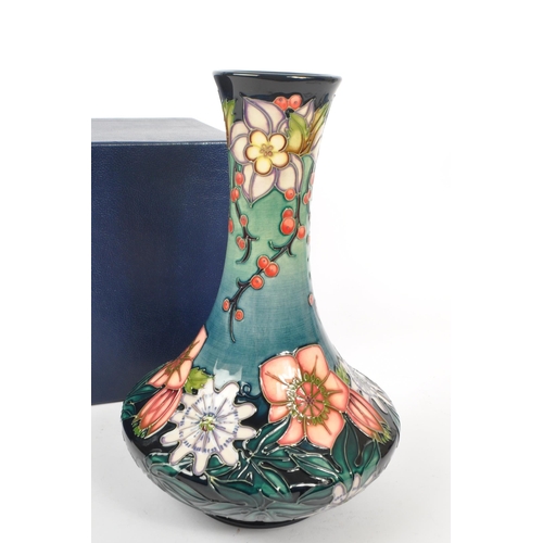 389 - Moorcroft - A china Moorcroft vase in the ' Carousel ' pattern by Rachel Bishop, her signature and n... 