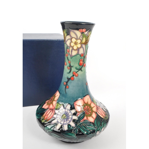 389 - Moorcroft - A china Moorcroft vase in the ' Carousel ' pattern by Rachel Bishop, her signature and n... 