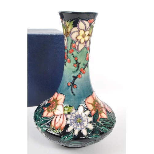 389 - Moorcroft - A china Moorcroft vase in the ' Carousel ' pattern by Rachel Bishop, her signature and n... 