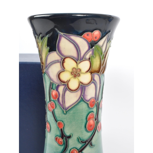 389 - Moorcroft - A china Moorcroft vase in the ' Carousel ' pattern by Rachel Bishop, her signature and n... 